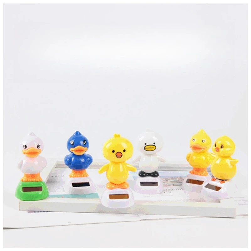

Suitable for car dashboard/desktop, little yellow duck solar ornament, shaking head doll, sun automatic swing