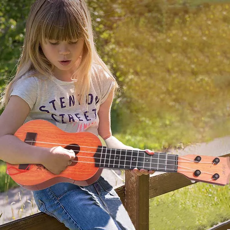 Mini ukelele de simulación de plástico para niños, guitarra pequeña para principiantes, instrumento Musical, juguetes educativos, regalos, 1 piezas