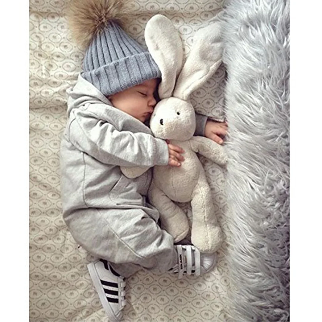 Casquette d'hiver en laine tricotée pour enfants, personnalisable avec n'importe quel LOGO, casquette chaude de Protection des oreilles en boule de fourrure pour l'extérieur et l'usure quotidienne, nouvelle collection