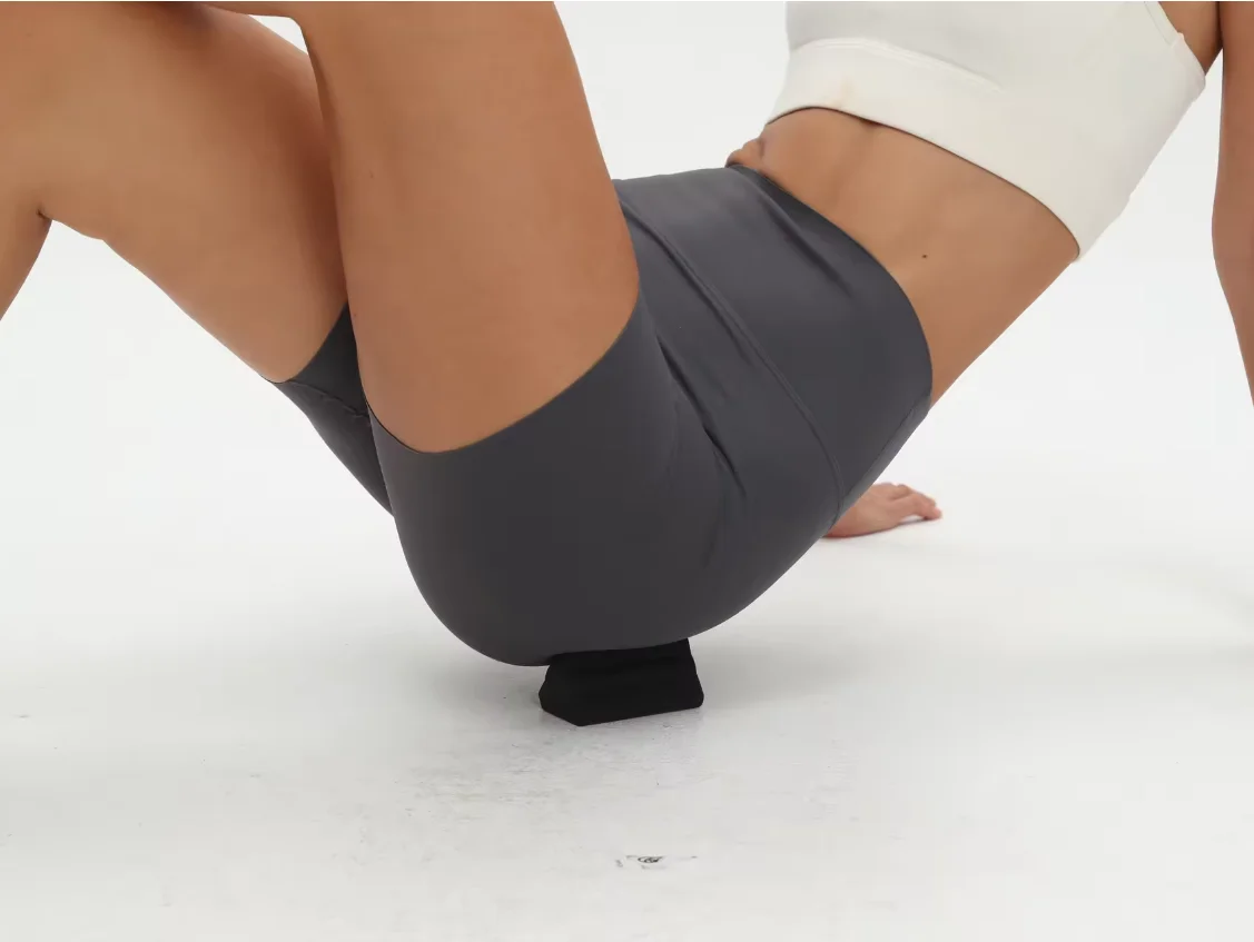 Piriformis muscle relaxation tool, featuring a silicone three-pronged design, designed to help relax deep, sore muscles.