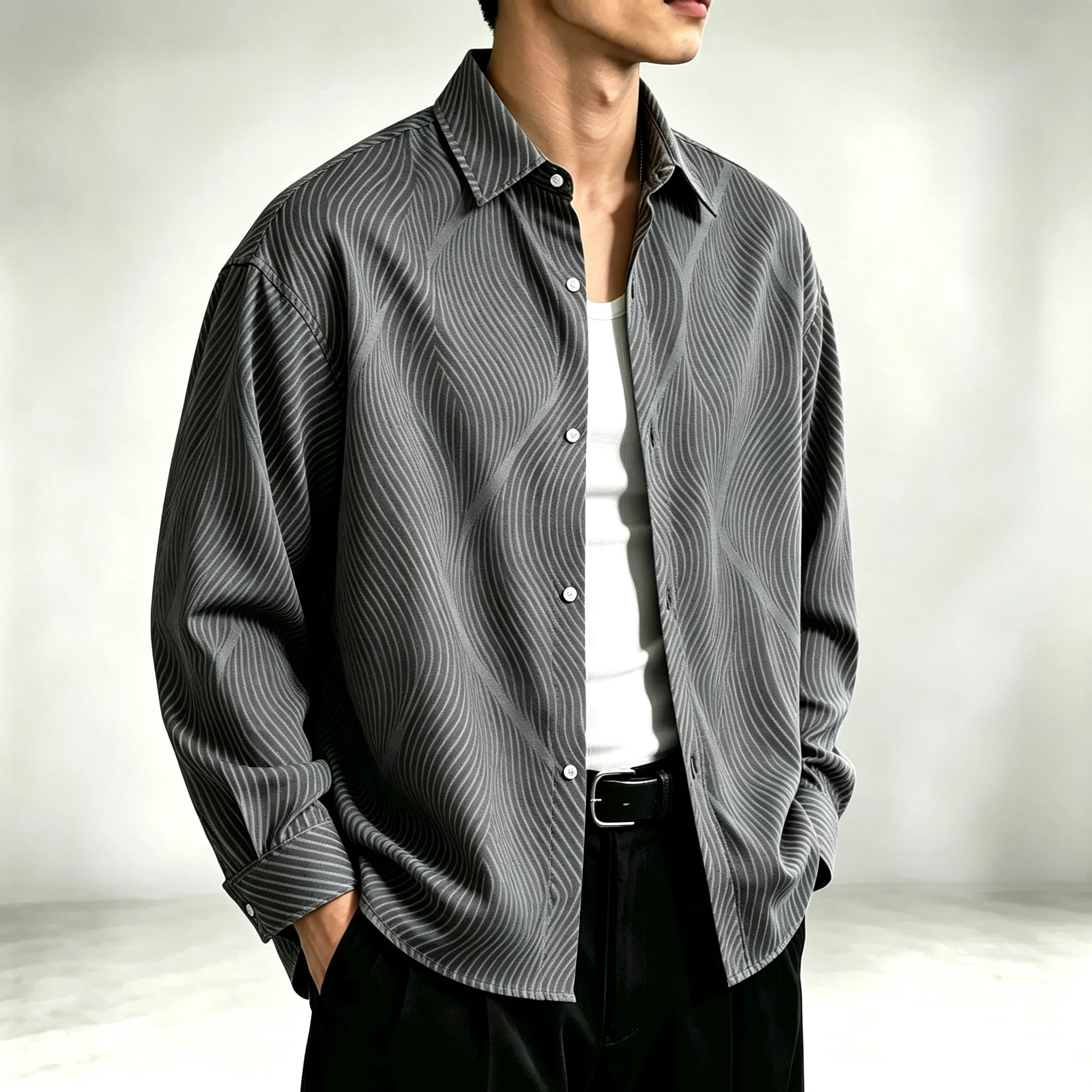Men's black long-sleeve collared shirt featuring a white geometric wavy-line print; a trendy, casual urban top for men.