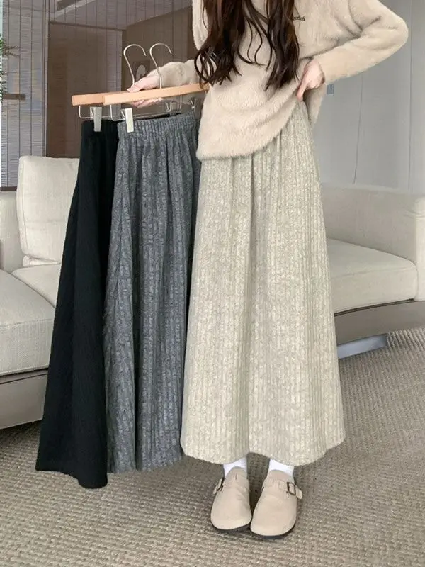 

Texture Cake Skirt Female Autumn New Long Irregular Joker High Waist Skirt.