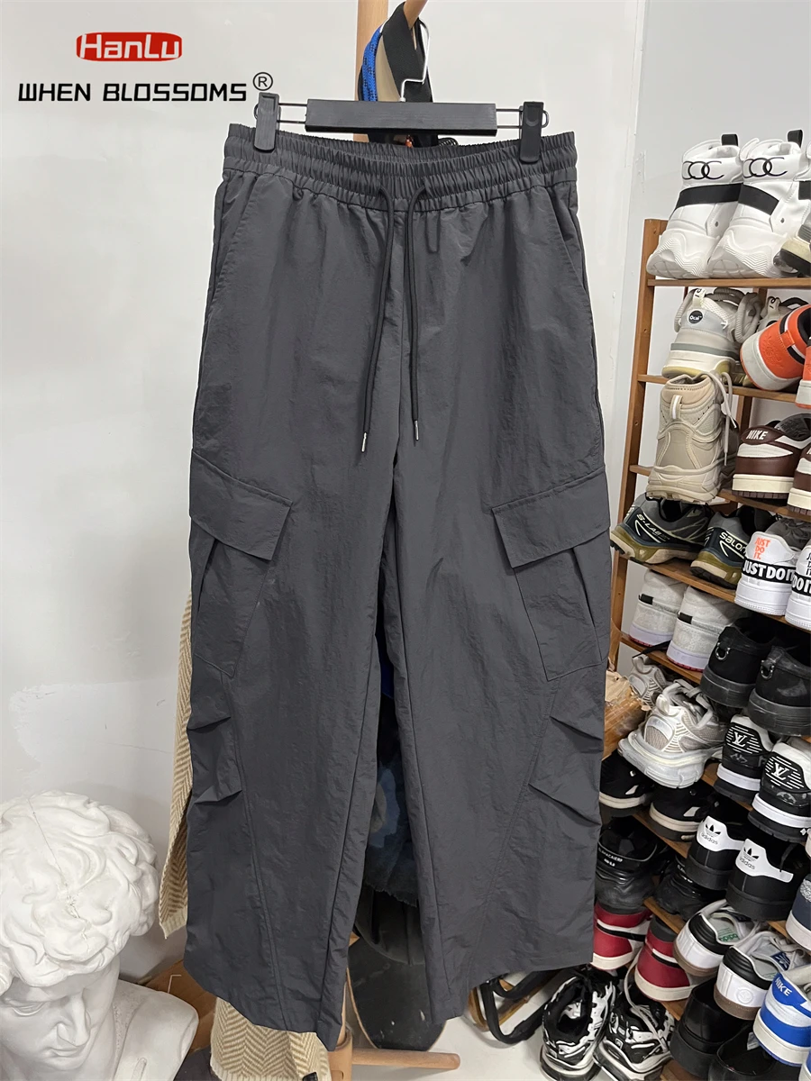 HANLU Pantaloni da lavoro tattici impermeabili all'aperto nuovi autunnali da uomo Tasche oblique Pantaloni cargo casual larghi dal design alla moda