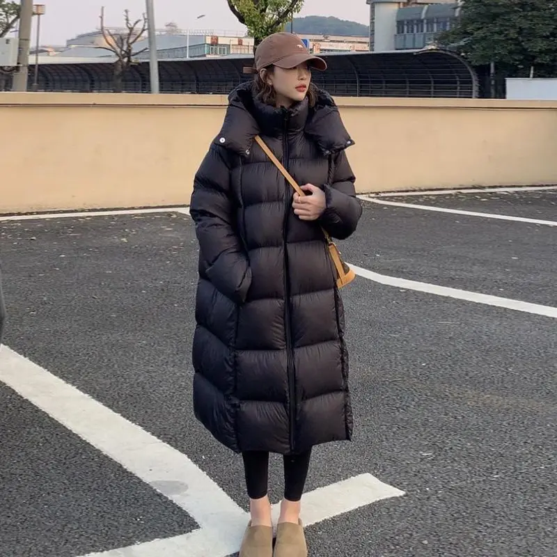 جاكيت شتوي جديد منفوخ بتصميم كوري فضفاض وعصري، معطف طويل سميك من ريش البط الأبيض مع غطاء للرأس مقاوم للرياح