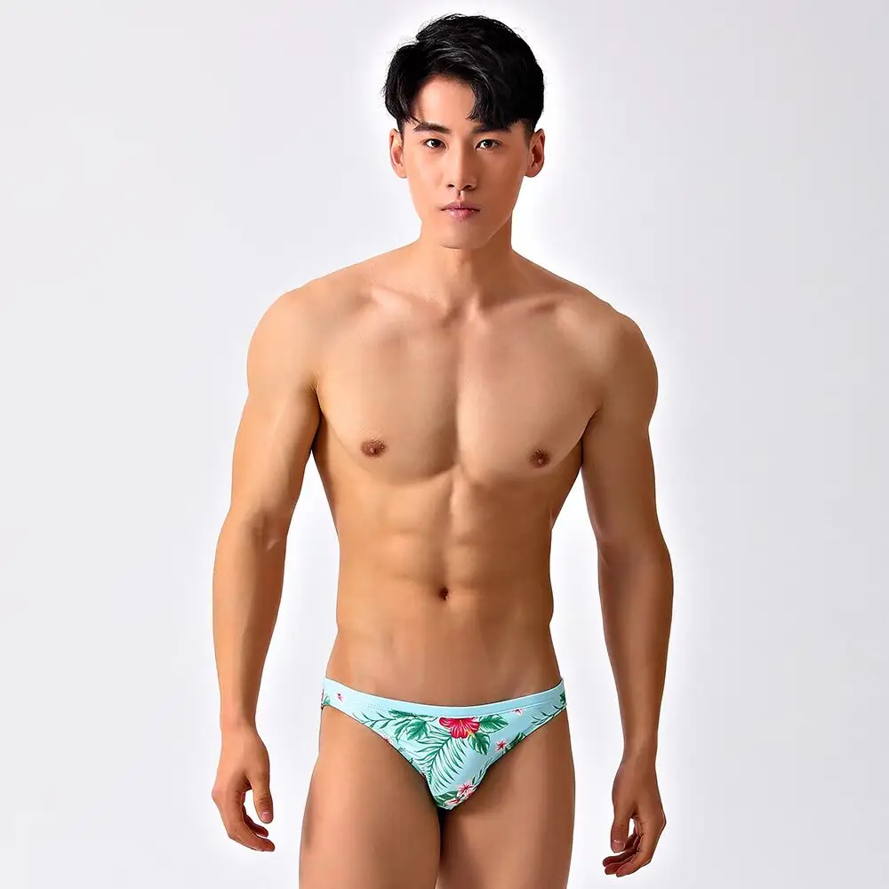 new Man triangle swimming trunks with low waist half wrapped buttocks narrow edge sexy rainbow swim shorts direct sales  2526