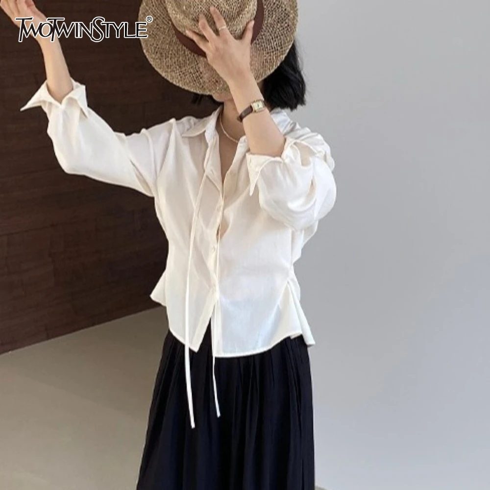 

TWOTWINSTYLE Solid Spliced Lace Up Loose Blouses for Women Lapel Long Sleeve Temperament Patchwork Button Shirt Female