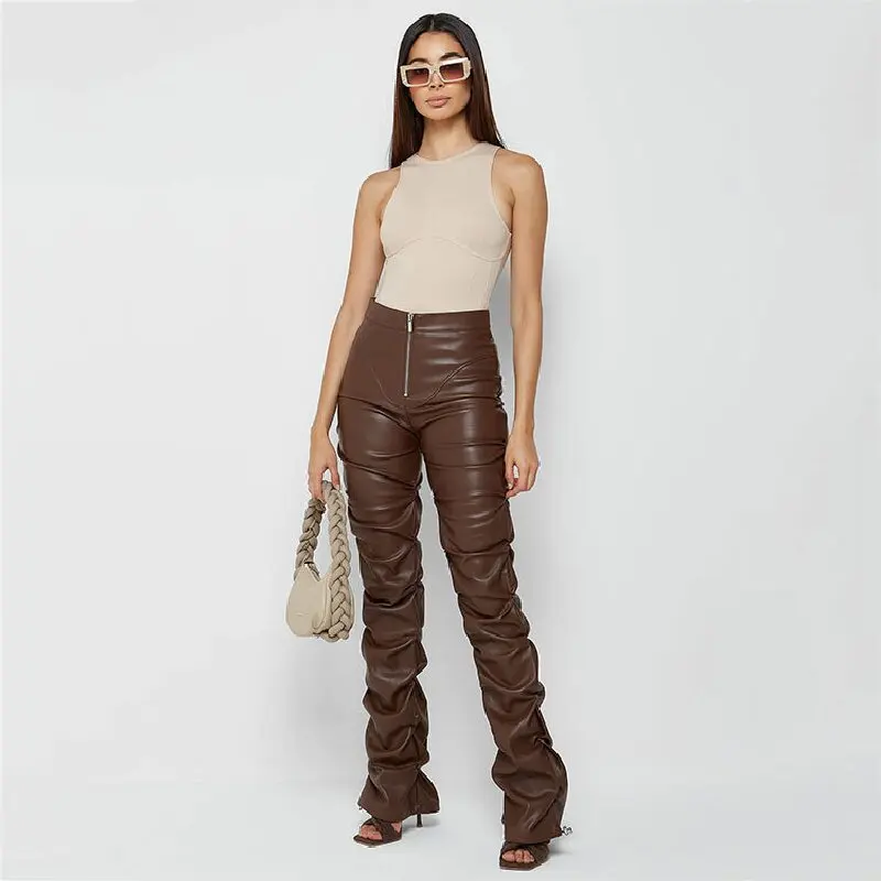 Stylish, tight-fitting PU leather trousers with a unique flared design and pleats.