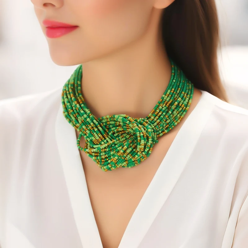 A Bohemian-style necklace featuring fresh green tones, handcrafted with small beads strung together in a woven pattern.