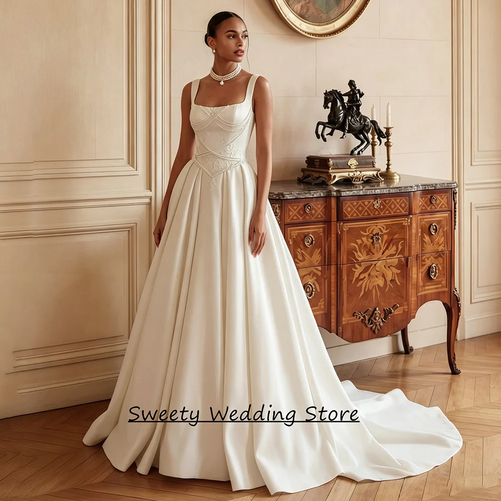 Vestido de Noiva Personalizado Nova Chegada Decote Quadrado Sem Mangas com Apliques de Pérolas Cauda Curta Corpete Vestido de Noiva
