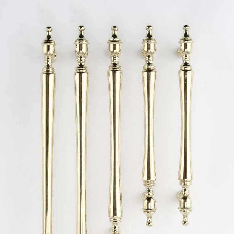 Decorative ends of five upright gold cabinet pulls