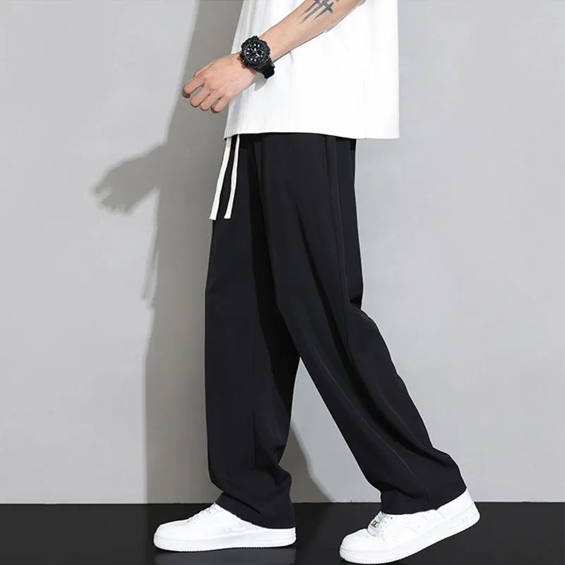 Calça casual de seda de gelo masculina, calça masculina fina e respirável, calça reta de perna larga, corredores elásticos, primavera, verão, 2021