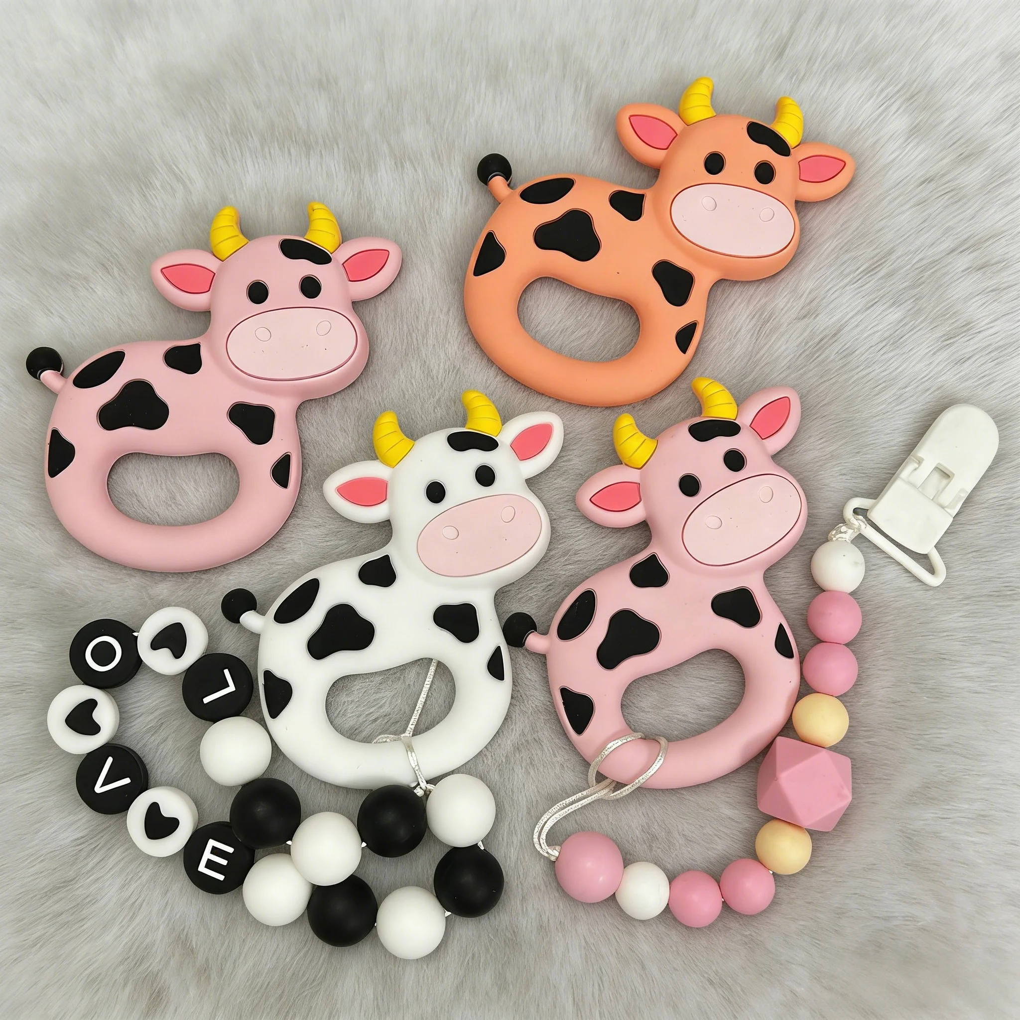 

Baby Teether for Sore Gums Relief Pack Cute Cartoon Cow Chew Toys with Pacifier Chain BPA Free Made of Safe Food Grade Silicone