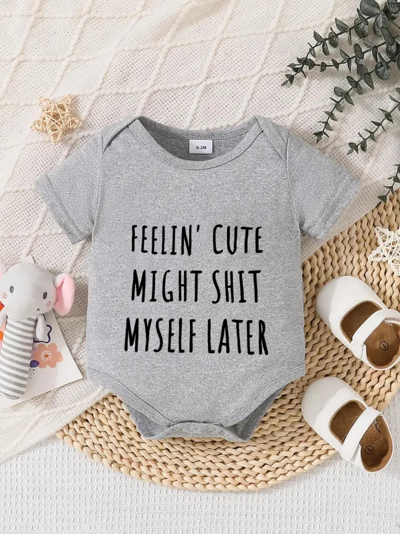 Playful letter-printed baby short-sleeve triangle bodysuit. Button closure for easy dressing, machine washable