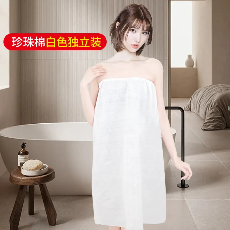 This disposable bath towel and apron set is made of soft polyester blend fabric, featuring a stylish design and comfortable fit.