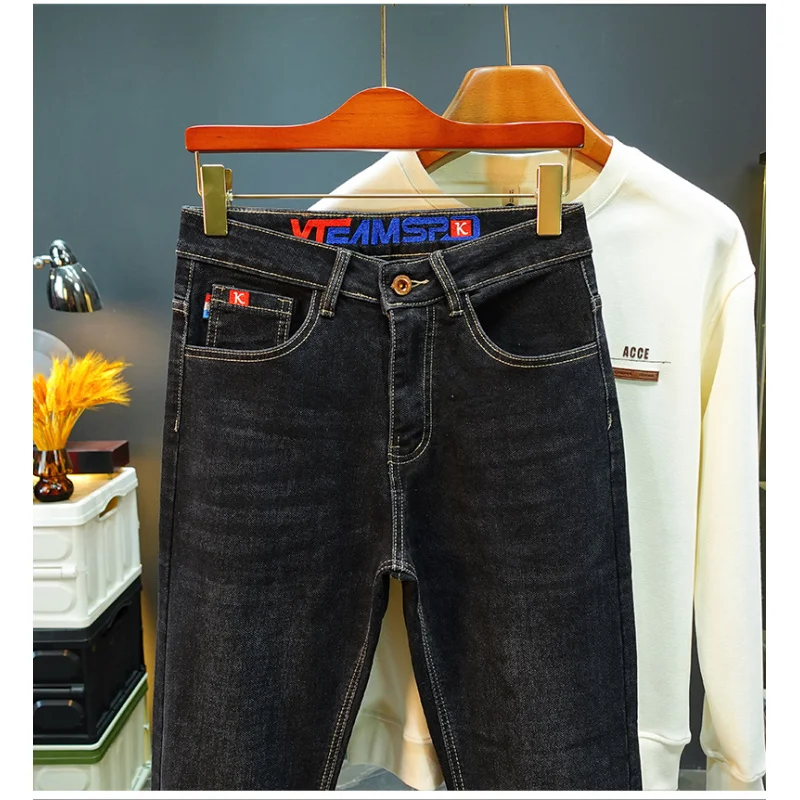 

Light luxury high-end jeans men's autumn 2025 new men's clothing elastic slim fit small feet embroidered print design long pants