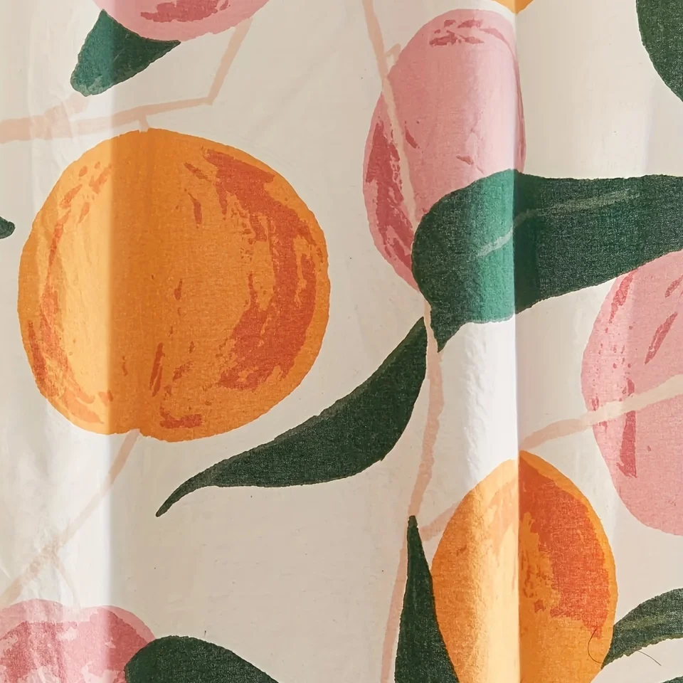 Decorate your bathroom with this vibrant orange apple shower curtain with hooks!