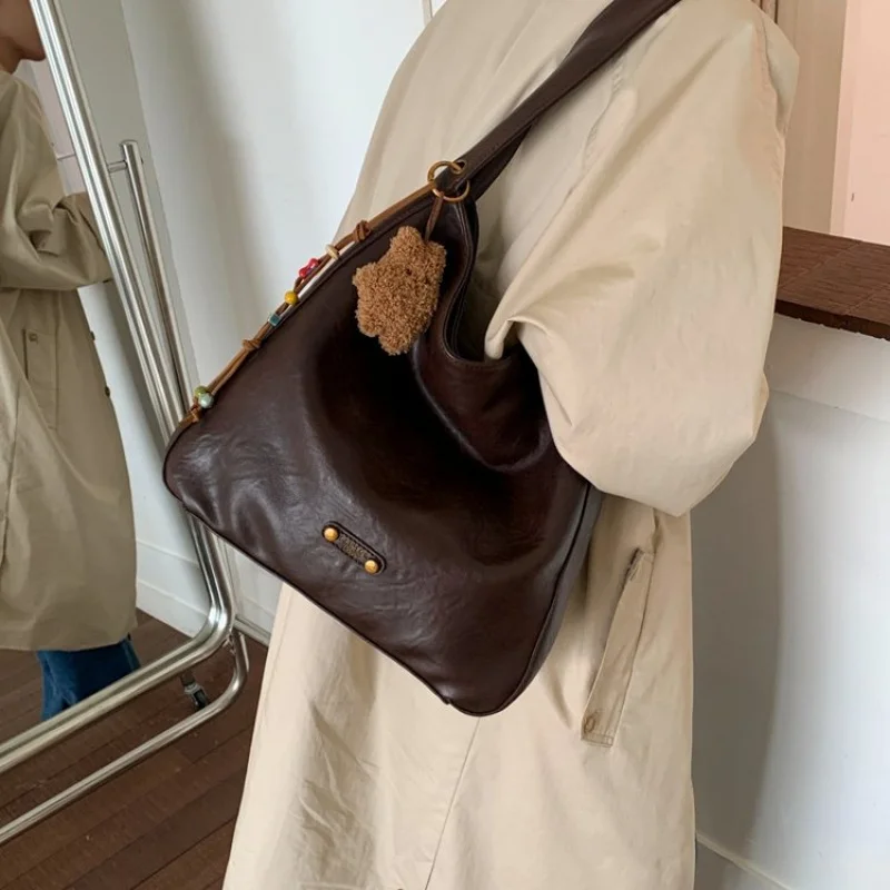 

2025 Новая элитная брендовая женская кожаная сумка на плечо известного дизайнера, простая элегантная парижская сумка ​