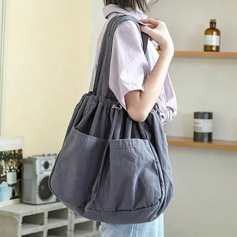 2023 New Canvas Bag Women's One Shoulder Drawstring Multi Pocket Japanese Simple Large Capacity Casual Versatile Tote Bag