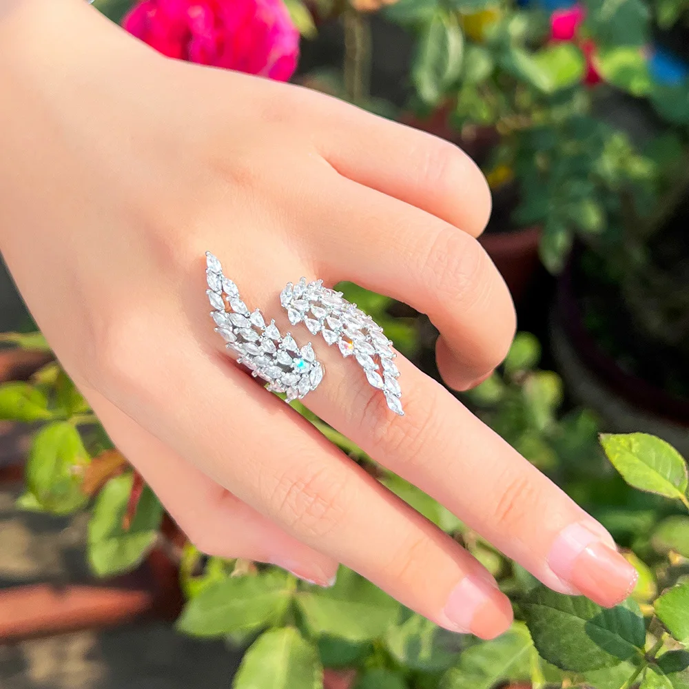 CWWZircons New Trendy Angel Wing Bling White Cubic Zirconia Open Cuff Adjustable Long Finger Ring for Women Wedding Evening R272