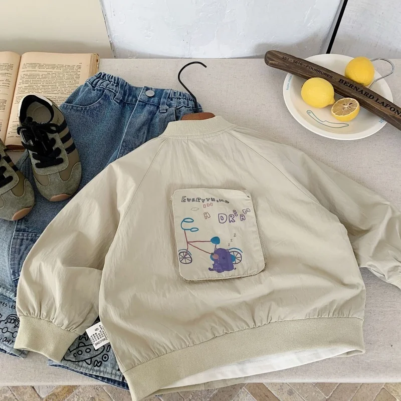 Abbigliamento per bambini Cappotto casual in tinta unita per bambini 2025 Primavera Nuova giacca stampata a maniche lunghe per ragazzi e ragazze alla moda