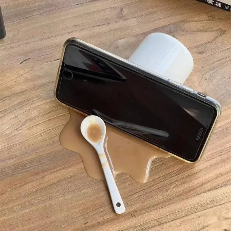 Spilled coffee spilled sand scary quirky tabletop decor toy funny phone holder