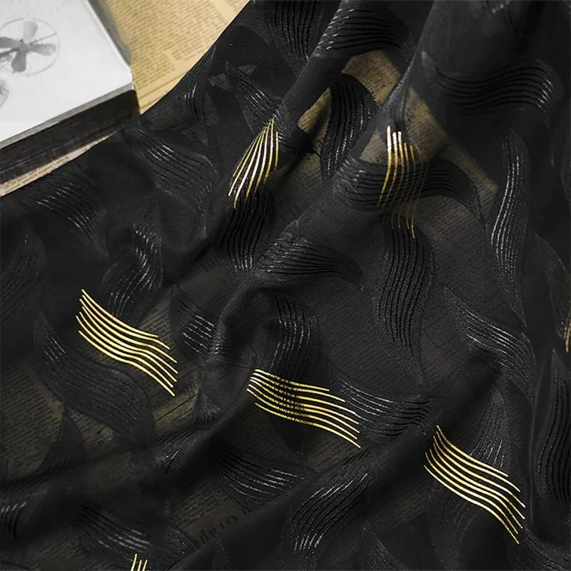 Soft Luxurious Black Chiffon Fabric with Intricate Gold Foil Cutouts - Ideal for Designer Clothing and Accessories By The Meter