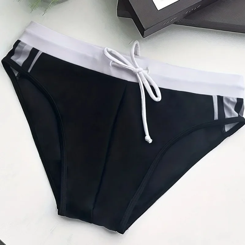 

New high elastic anti-light anti-embarrassment triangle men's swimming trunks sexy low-waist tether spot E9J03