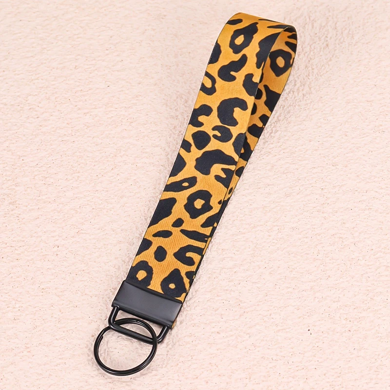 Porte-clés de luxe imprimé léopard anti-perte pour téléphone, lanière d'enseignant, porte-clés de voiture, porte-clés de poignet, cadeau pour femme