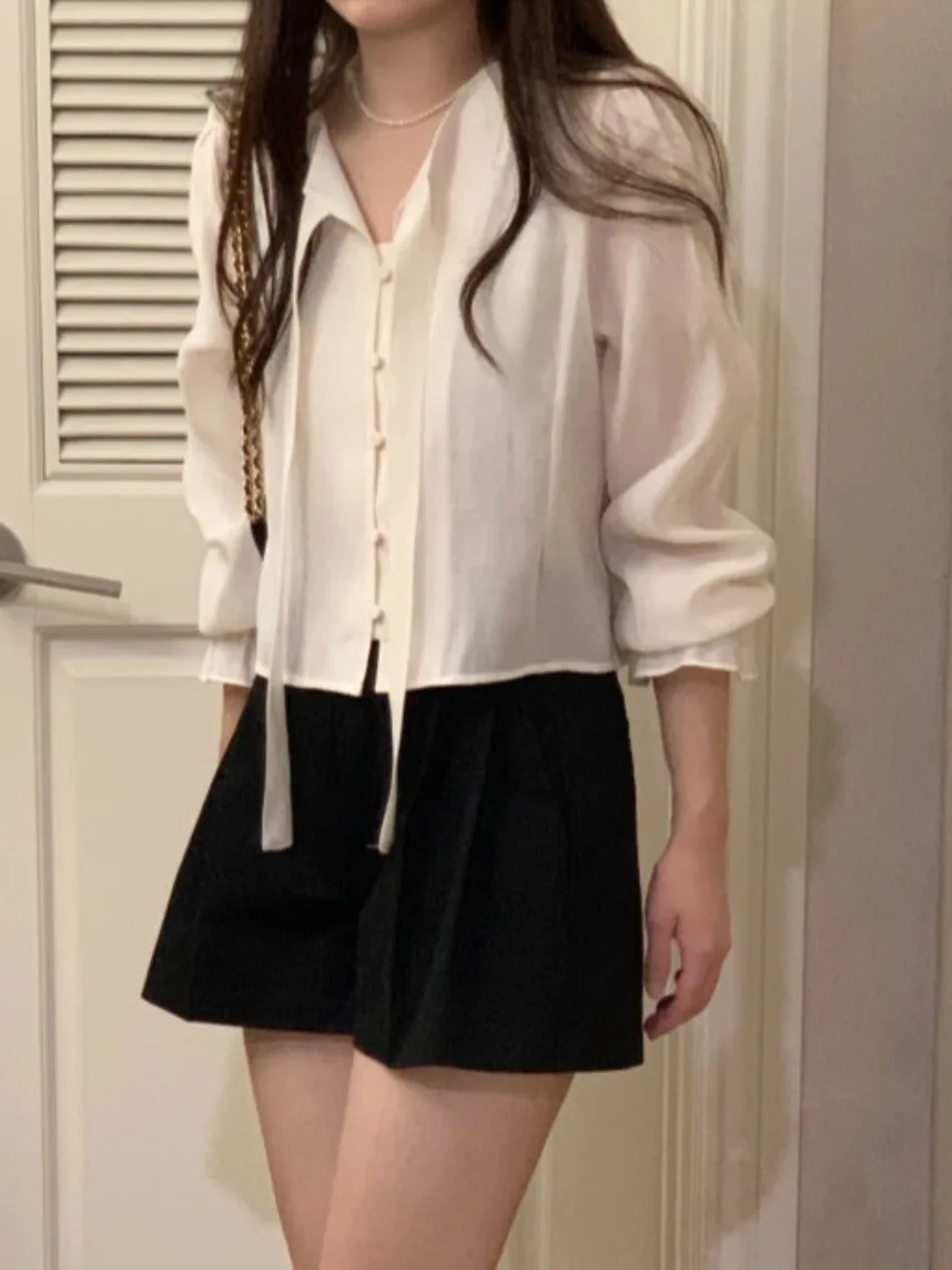 تصميم كوري للنساء ort Sve irt ربيع 2025 جديد Sweet Ele Faionable Bell Sve Top Commute Sle Pure E-commerce