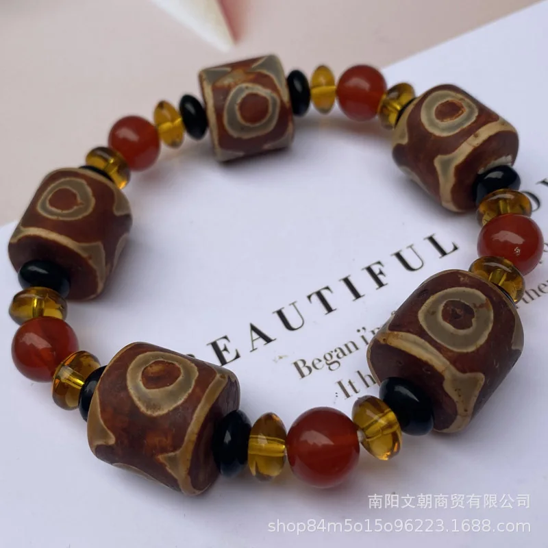 Agate bracelet with three eyes and a large bucket of beads separated by round beads bracelets at the night market temple fair.