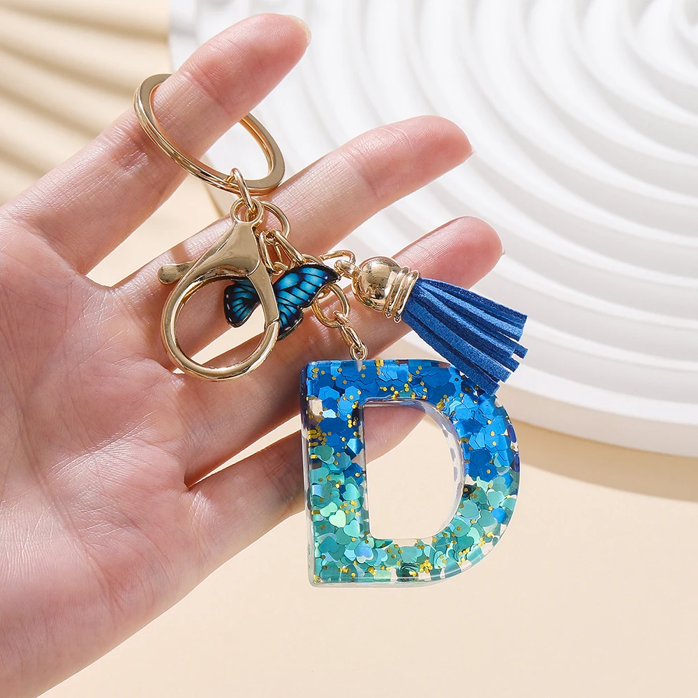 1 قطعة سبائك الأبجدية المفاتيح الأولية الملكي الأزرق فراشة وشرابة رسالة المفاتيح لحقيبة الظهر سحر الإكسسوارات حلقة رئيسية النتائج