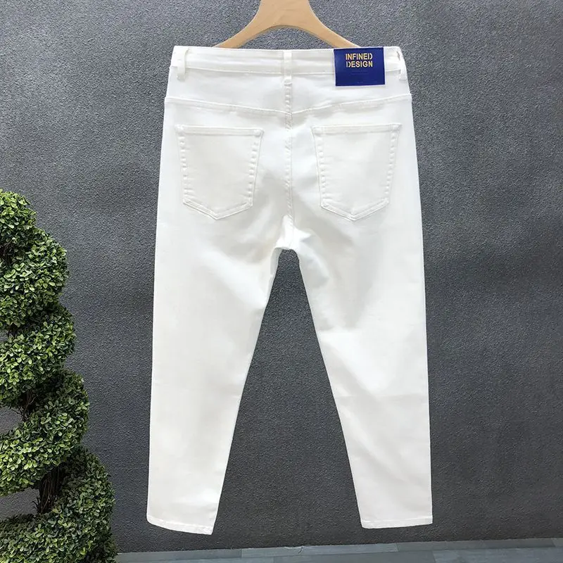 Pantalones vaqueros elásticos de algodón para hombre, ropa informal de lujo, color blanco y negro, ajustados, para novio, Verano