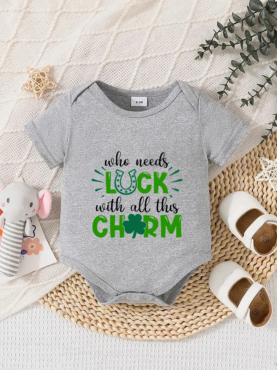 Playful letter-printed baby short-sleeve triangle bodysuit. Button closure for easy dressing, machine washable