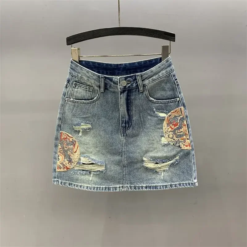 Embroidered hole denim skirt female 2024 summer new high waist fashion temperament slim A word bag hip elegant skirt.