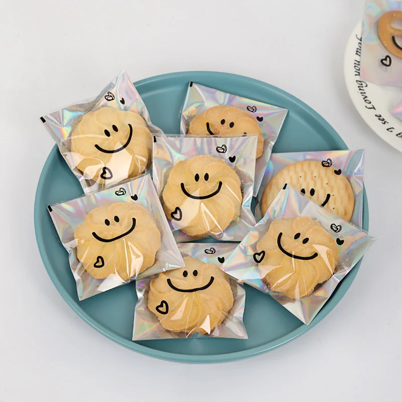 100pcs Snowflake Crisp Cookie Packaging Bag Cute Smiling Face Self-adhesive Bag Laser Transparent Biscuit Bag