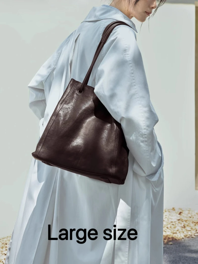 Minimalistischer Stil aus echtem Leder, große Kapazität, Damen-Nischen-Retro-Rindsledertasche, vielseitige Eimer-Schulter-Crossbody-Tasche