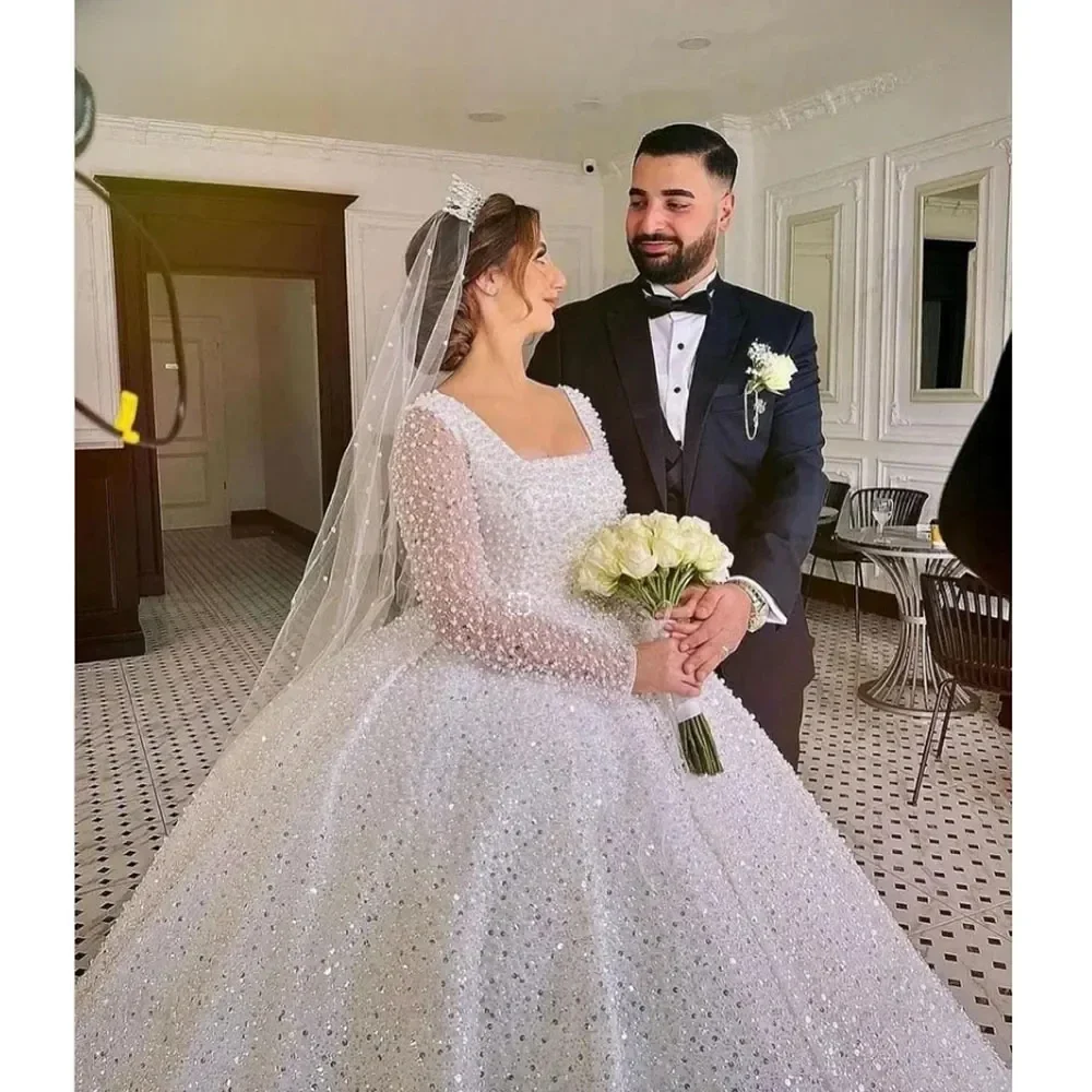 Luxurious Sparkling Lace Bead Princess Wedding Dress Sexy Square Neck Transparent Long Sleeve Auditorium Bridal Dress Customized