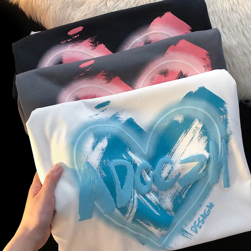 T-shirt da donna di tendenza moda coreana t-shirt da donna con stampa di lettere a cuore enorme o-collo manica corta t-shirt larghe abbigliamento stile Unisex