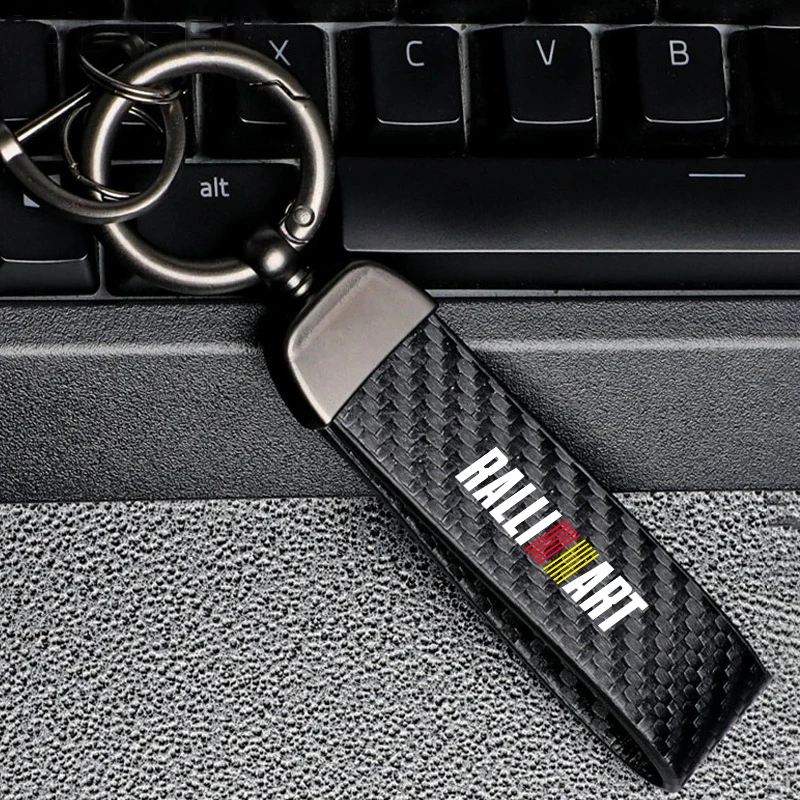 

Car Logo Keychain Carbon Fiber Keyring For Mitsubishi Ralliart Outlander Lancer 10 EX ASX Pajero L200 Colt Eclipse Triton Delica