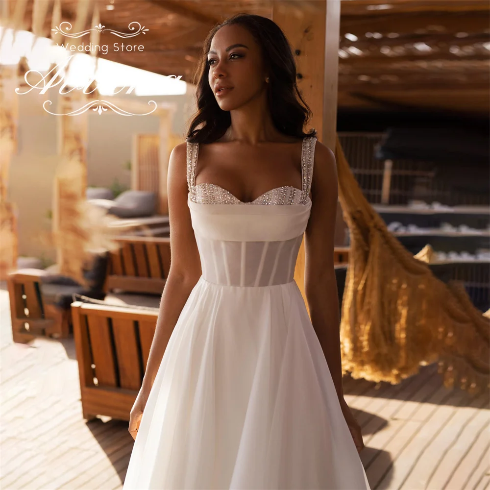 Aviana مخصص الحبيب الديكور إثارة ألف خط فستان الزفاف سويب تراين طول الأرض بلا أكمام الماس اللؤلؤ 2025