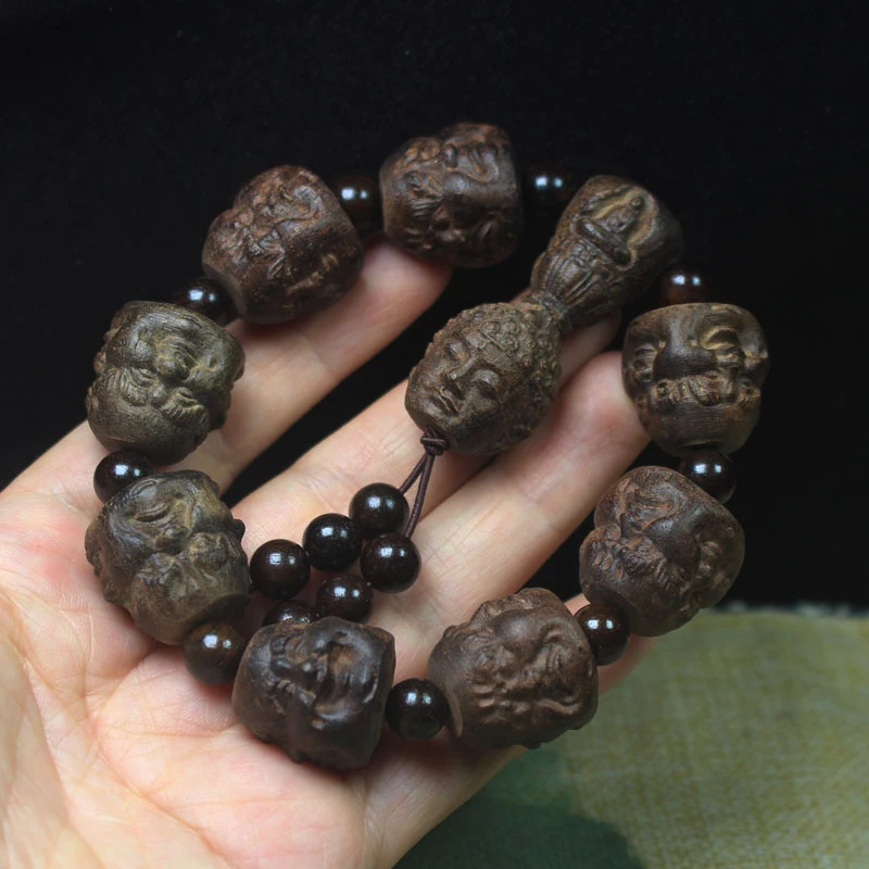 

Vietnamese agarwood four-sided Buddha and eighteen arhats bracelet, hand-carved Buddhist bead jewelry