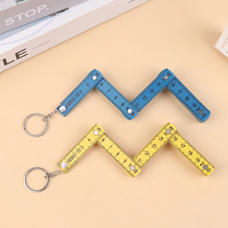 1ชิ้น0.5เมตร10พับพวงกุญแจพลาสติกความแม่นยำสูงไม้บรรทัดพับเก็บได้สำหรับการเดินทางงานไม้อิฐบ้าน DIY