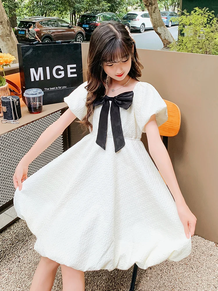 女の子の夏のバタフライバブルスリーブドレスピーチカラープリンセスドレスファッショナブルなミディスカート中大サイズの子供向け