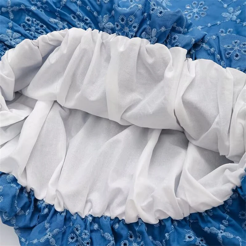 Keyanketian 2025 verão novo vestido feminino bordado deslizamento beachwear férias vento sem costas oco em camadas sem mangas mini vestido