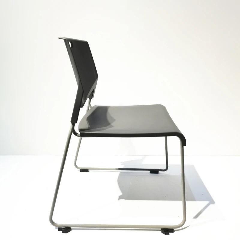 Modern all-plastic stackable armless chair with metal legs for use in schools, offices, hospitals, bars, apartments