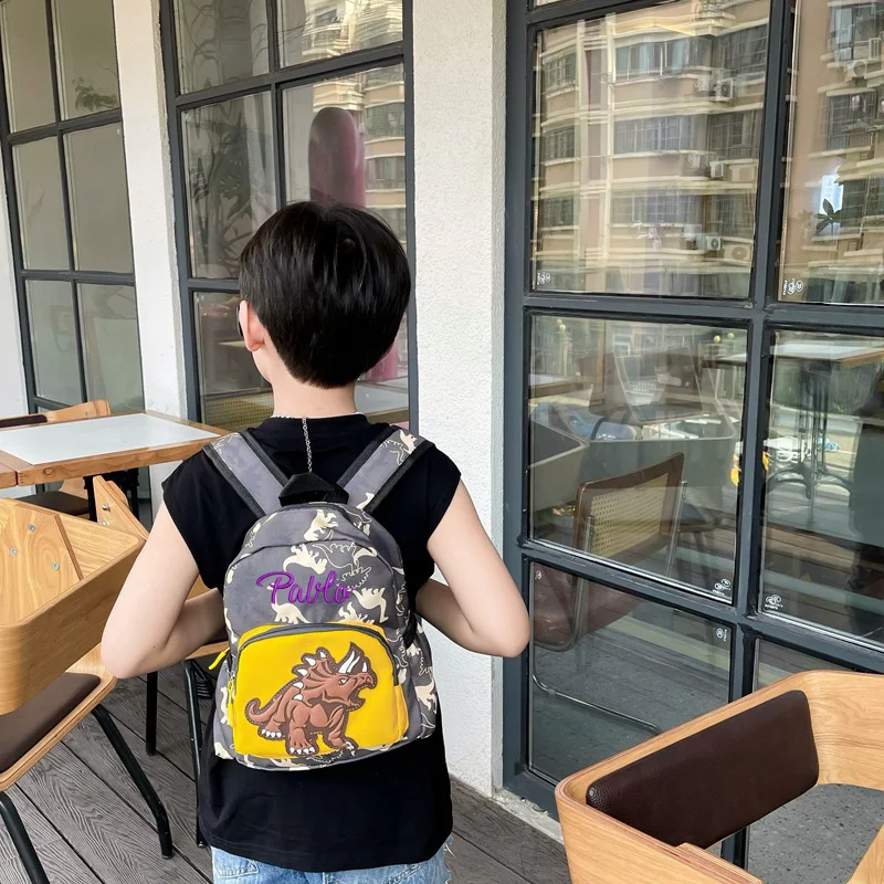 Mochila personalizada para niños y niñas, nueva mochila moderna con diseño de dinosaurio de dibujos animados para guardería