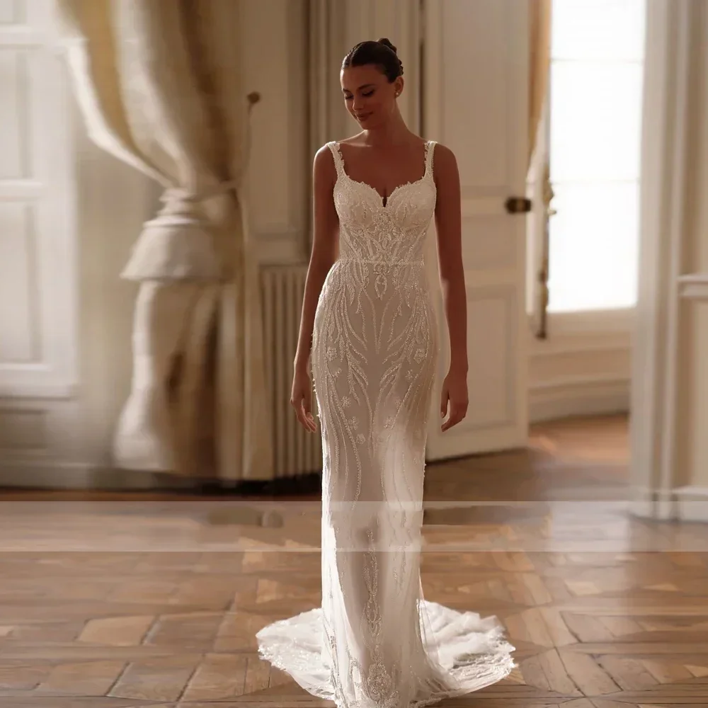 Abiti da sposa sexy personalizzati a sirena Abito da sposa con strascico staccabile con applicazioni senza maniche a cuore