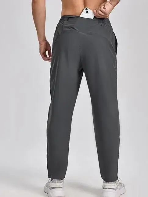 

Мужские беговые брюки, быстросохнущие и дышащие, с задним карманом на талии для хранения телефона.