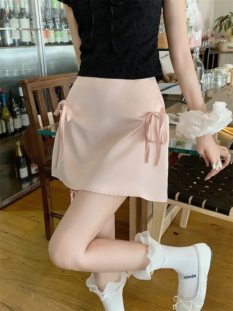 Satin bow tie skirt women's summer 2024 new design feeling slim summer anti-exposure high waist Joker hip skirt.