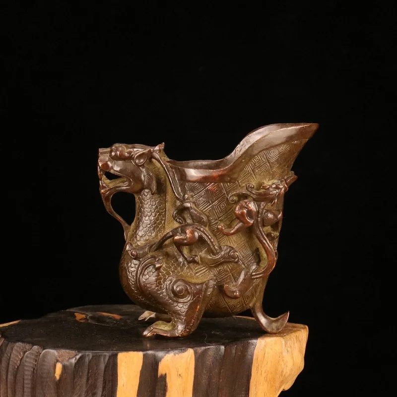 Nostalgic and vintage, pure copper carving of auspicious mythical creatures, a three-legged ancient wine cup, a copper vessel, a
